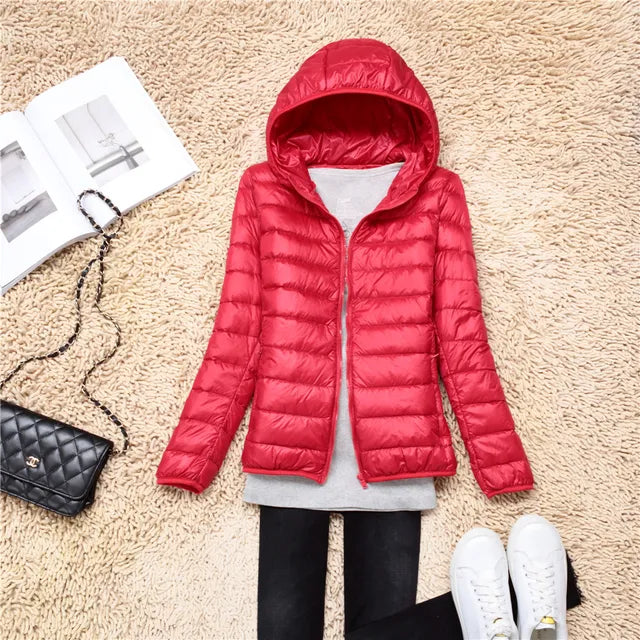Back view of women's packable puffer jacket, lightweight and travel-ready fall fashion.