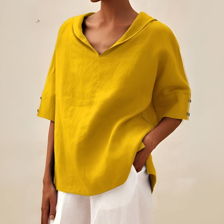 Relaxed fit short sleeve blouse for women. Lightweight fabric ensures comfort for casual everyday summer style.