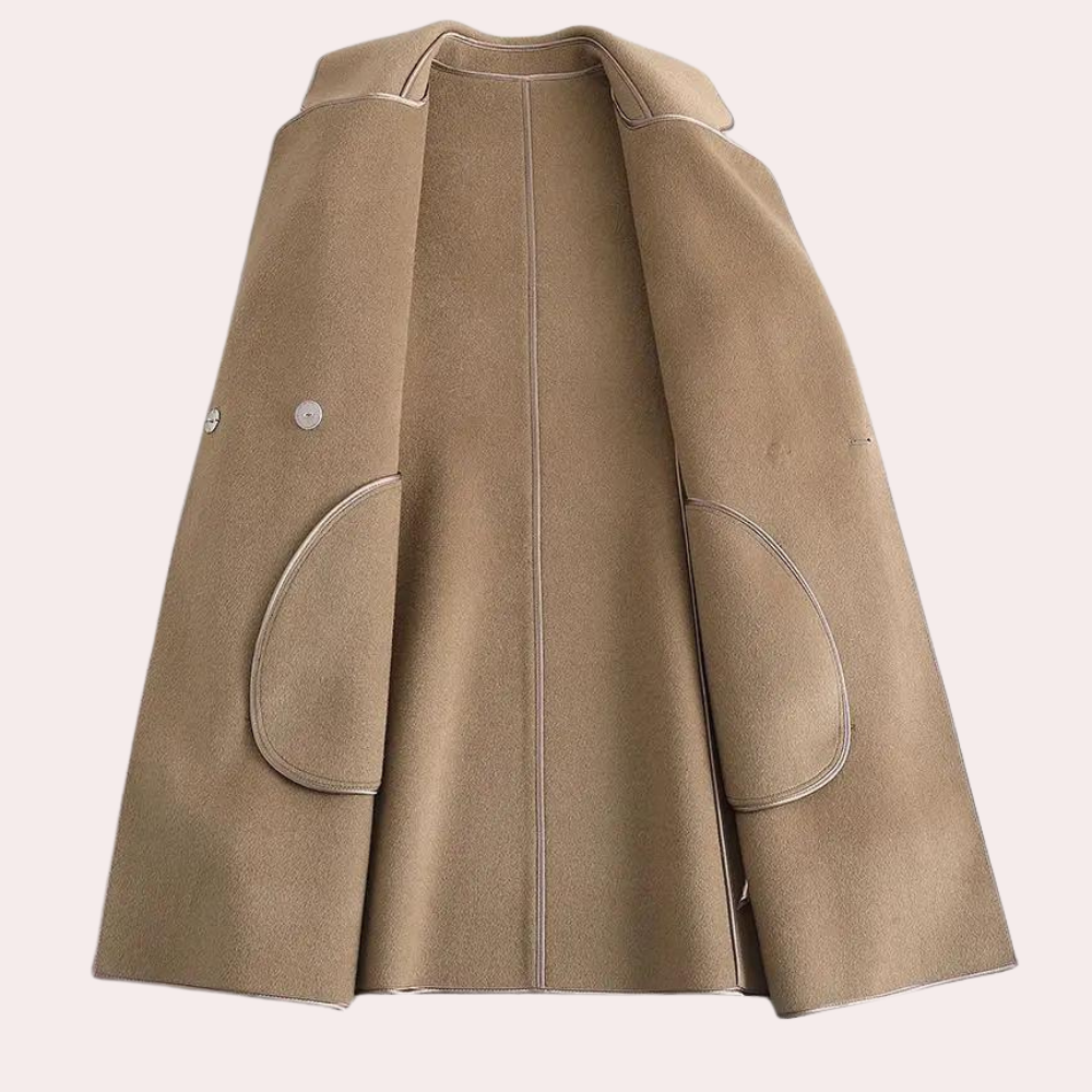 Lightweight women's trenchcoat in a flowy fabric. A perfect spring coat or fall style layering jacket.
