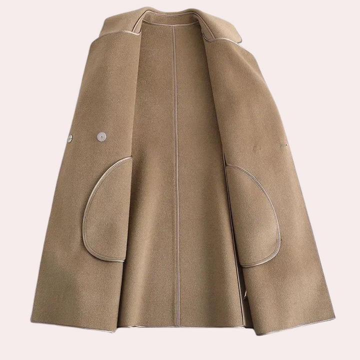 Lightweight women's trenchcoat in a flowy fabric. A perfect spring coat or fall style layering jacket.
