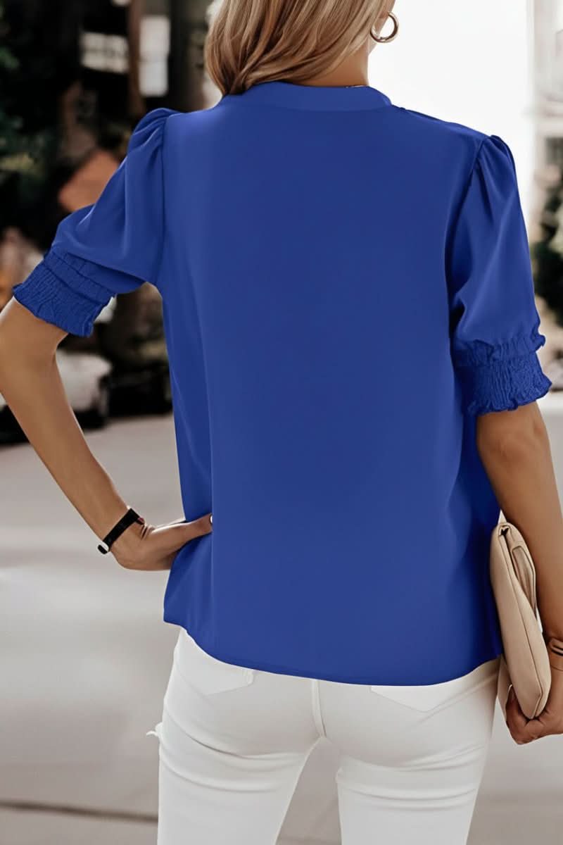 Loose fit women's lightweight V-neck blouse, comfortable and feminine with stylish puff sleeves.