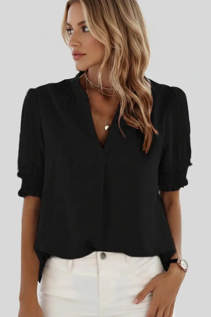Elegant lightweight V-neck blouse for women, featuring trendy puff sleeves and a comfortable loose fit.