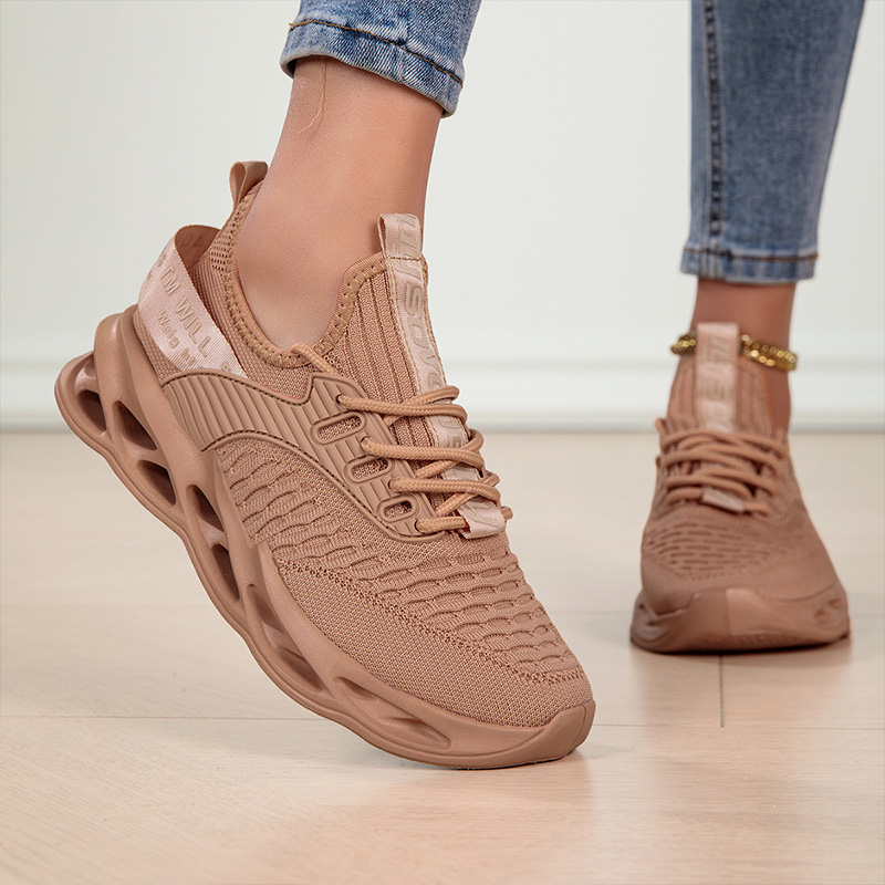 Athletic women's walking sneakers, offering lightweight support for an active lifestyle.