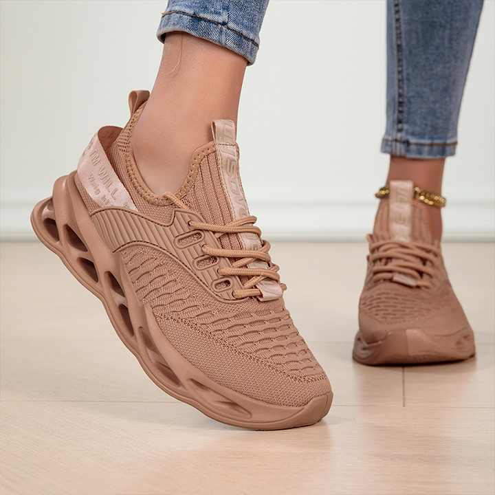 Athletic women's walking sneakers, offering lightweight support for an active lifestyle.