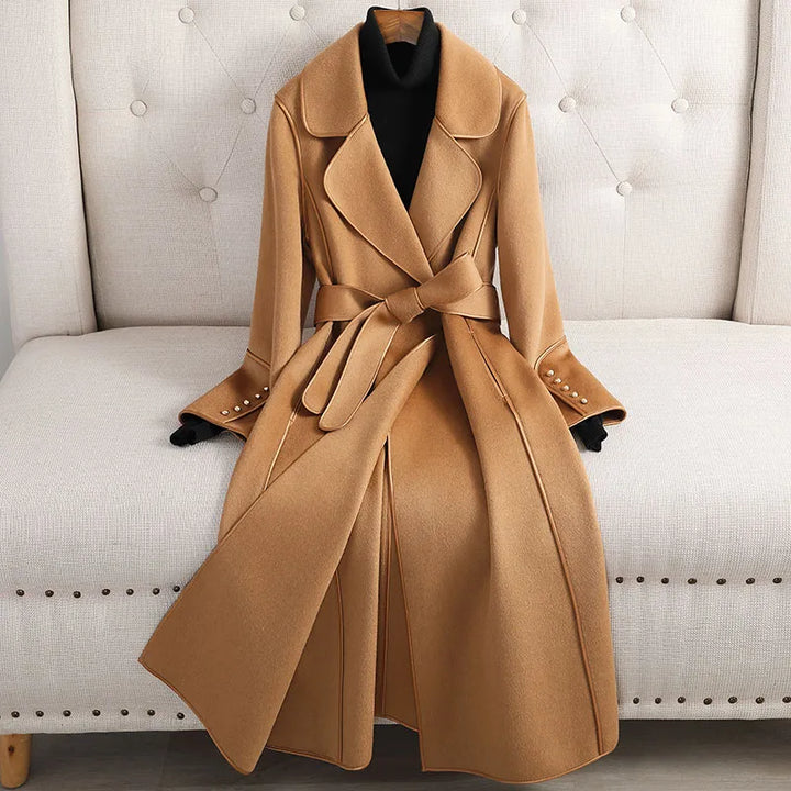 Women's long belted trench coat, tailored for elegant and versatile style in classic design.
