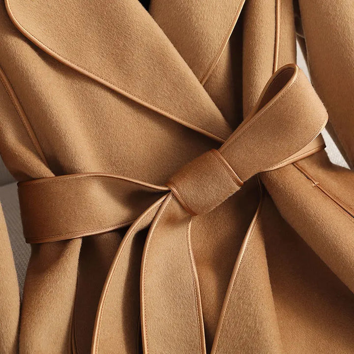 Tailored long belted trench coat for women, offering a sophisticated and elegant fit.