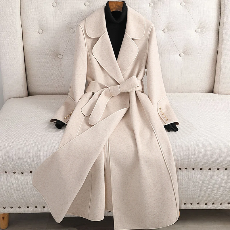 Elegant women's long trench coat, featuring a belted waist and classic tailored design for women.