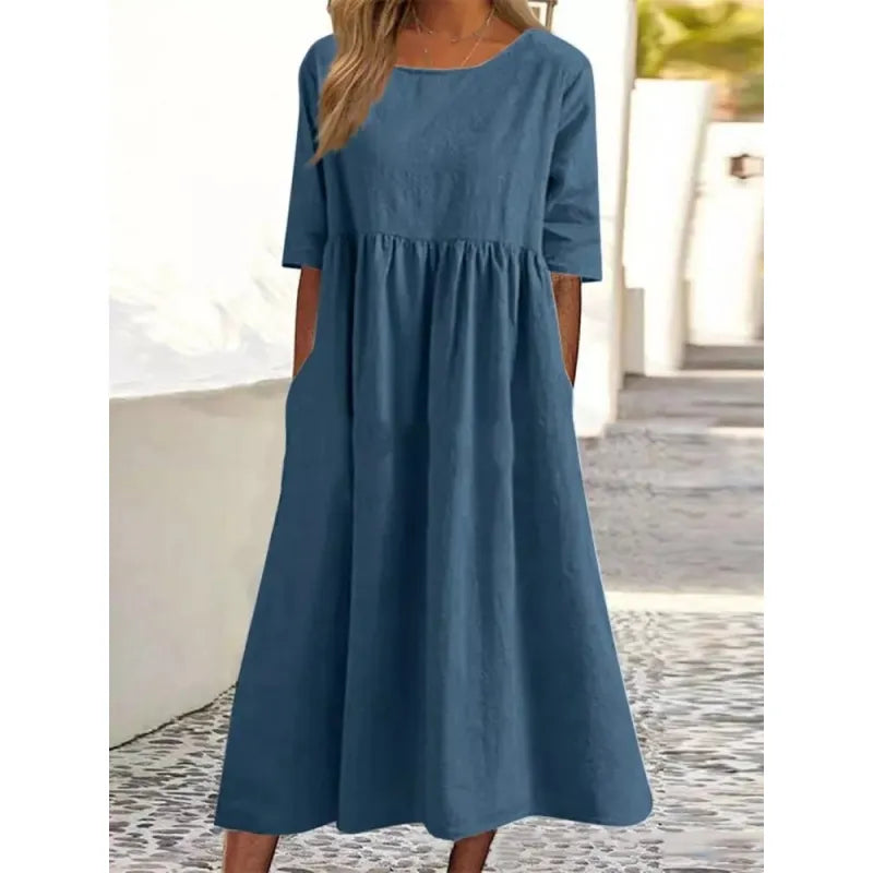 Modest women's casual maxi dress. Long design, comfortable fit, featuring half-sleeves and functional pockets.