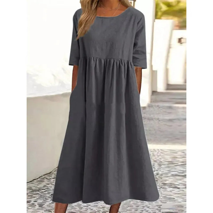 Versatile women's long dress. Comfortable half-sleeves & practical pockets. Perfect as a casual or summer maxi dress.