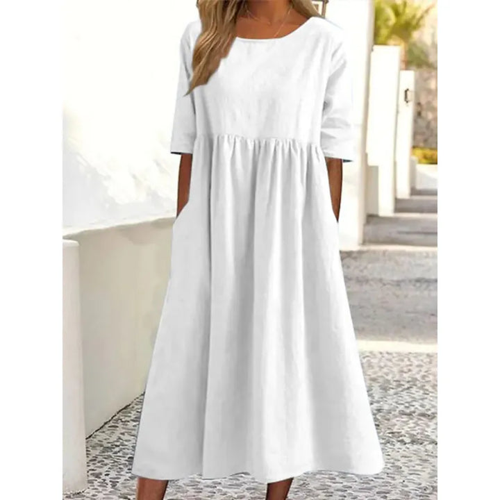 Soft women's long maxi dress with relaxed half-sleeves and useful pockets for everyday comfort and style.