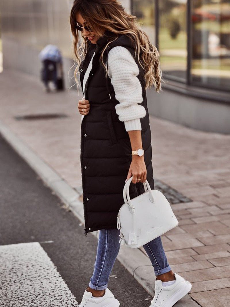 Women's long quilted bodywarmer vest for cozy fall and winter layering. Stylish sleeveless outerwear.