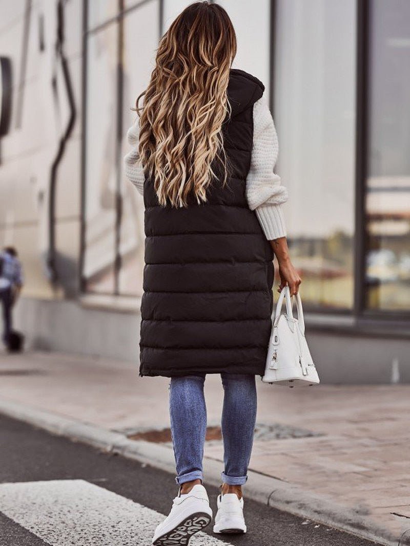 Cozy women's long quilted vest, a versatile sleeveless jacket. Perfect for casual fall fashion & winter style.