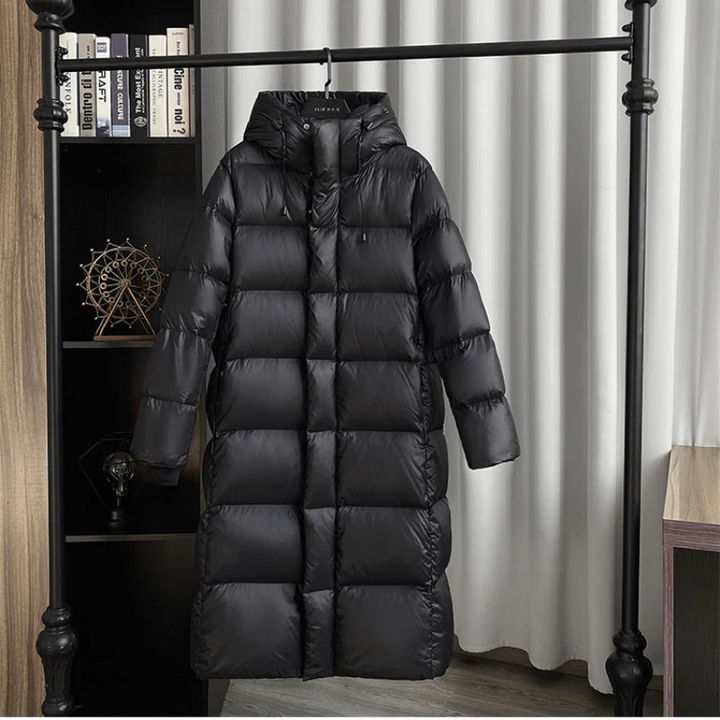 Warm women's quilted hooded winter jacket, a long coat design for ultimate cold weather protection.