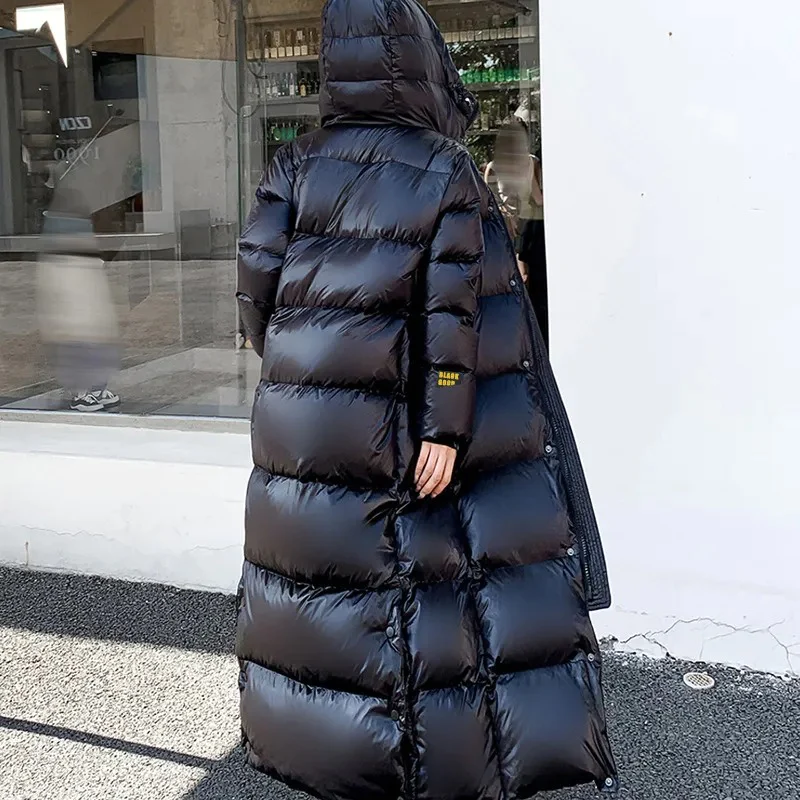 Durable women's long hooded quilted winter coat, providing excellent cold weather protection and style.