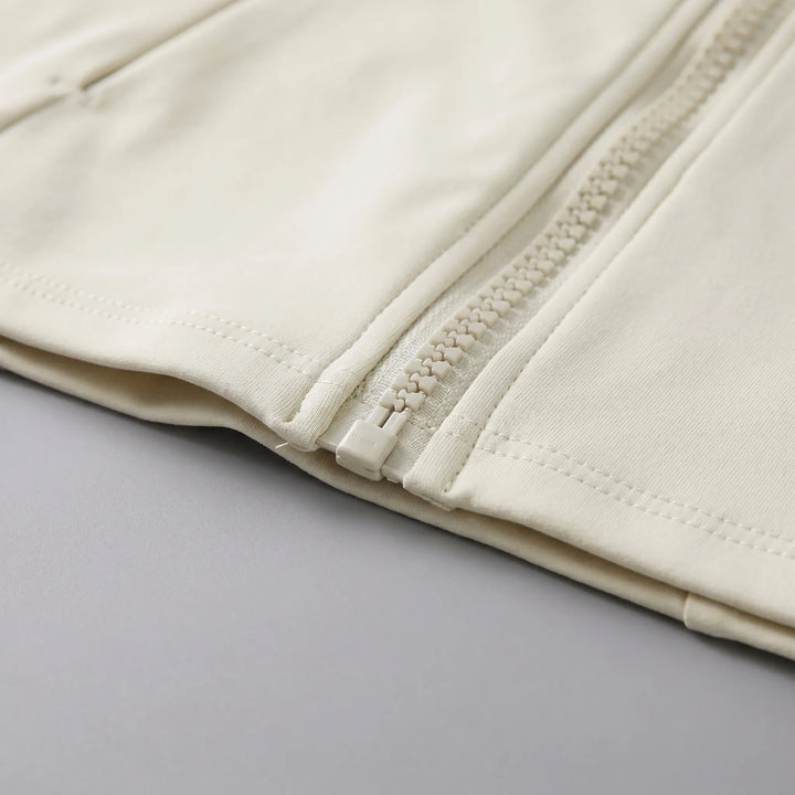 Comfortable women's performance workout jacket with thumbholes, ideal for sports and active fitness.