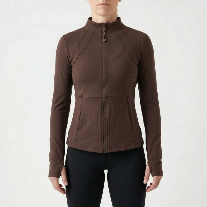 Women's fitted gym wear jacket with thumbholes, offering warmth and flexibility for intense workouts.