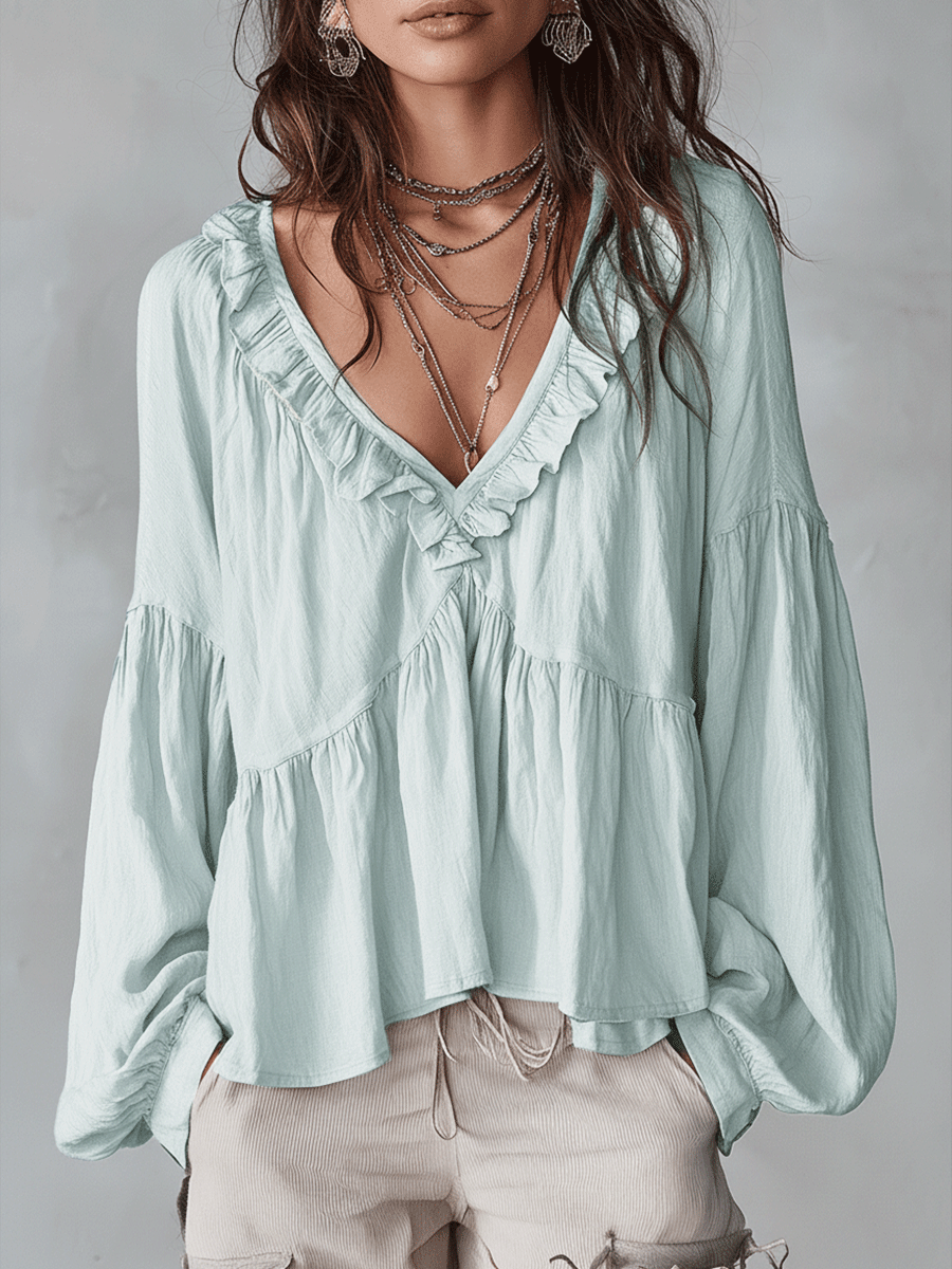 Comfortable loose fit women's long sleeve blouse. Bohemian ruffle top for casual spring fashion.