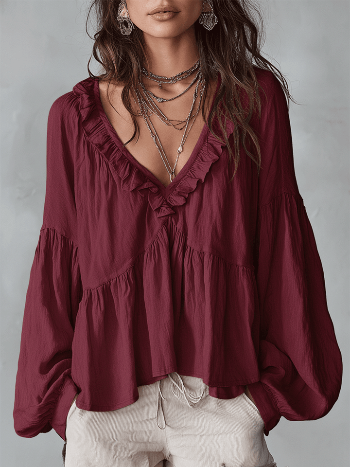 Spring fashion women's bohemian blouse, long sleeve & loose fit. Elegant ruffle top for everyday wear.