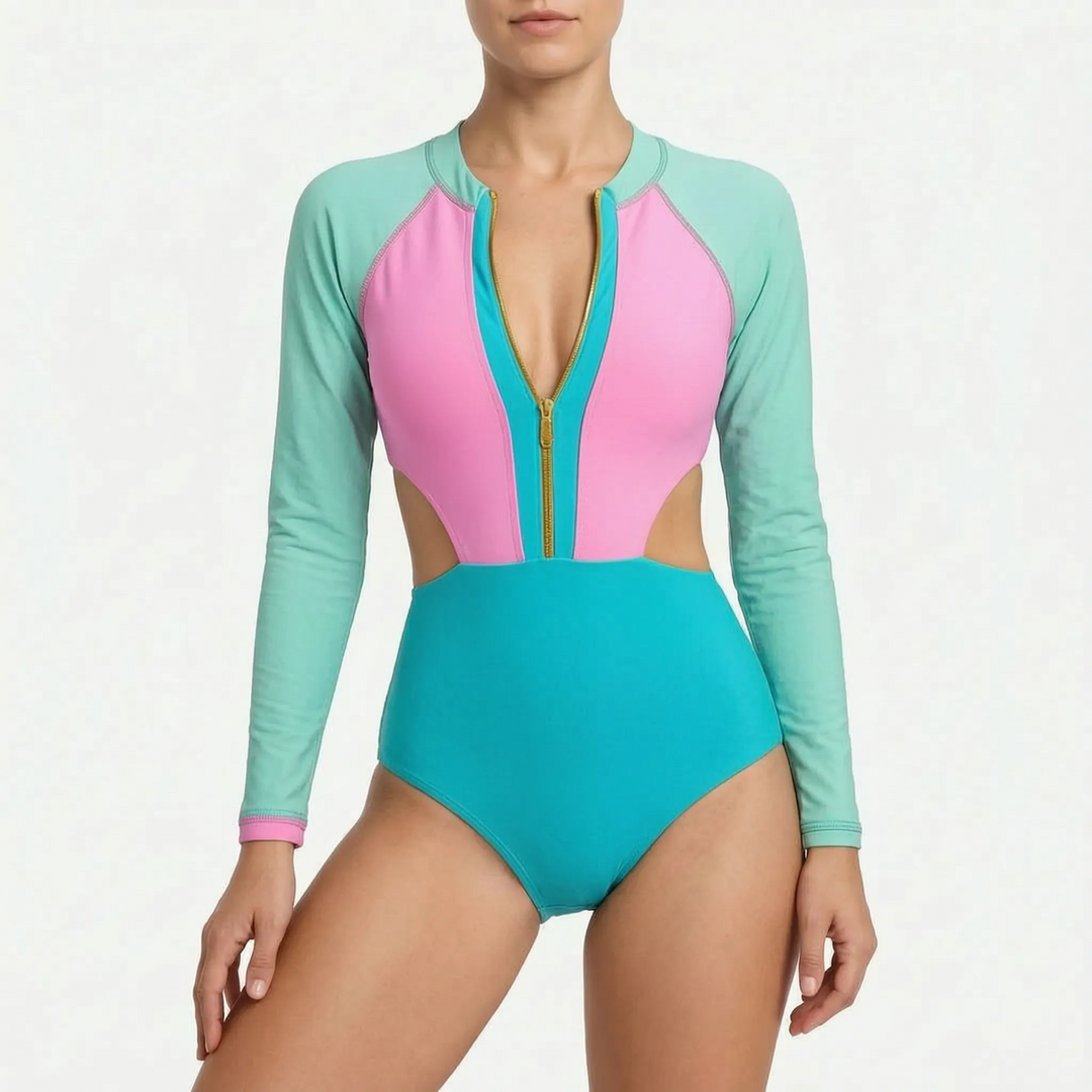 Women's active long-sleeve monokini. Color block cutout one-piece swimsuit offering sun protection for beachwear.