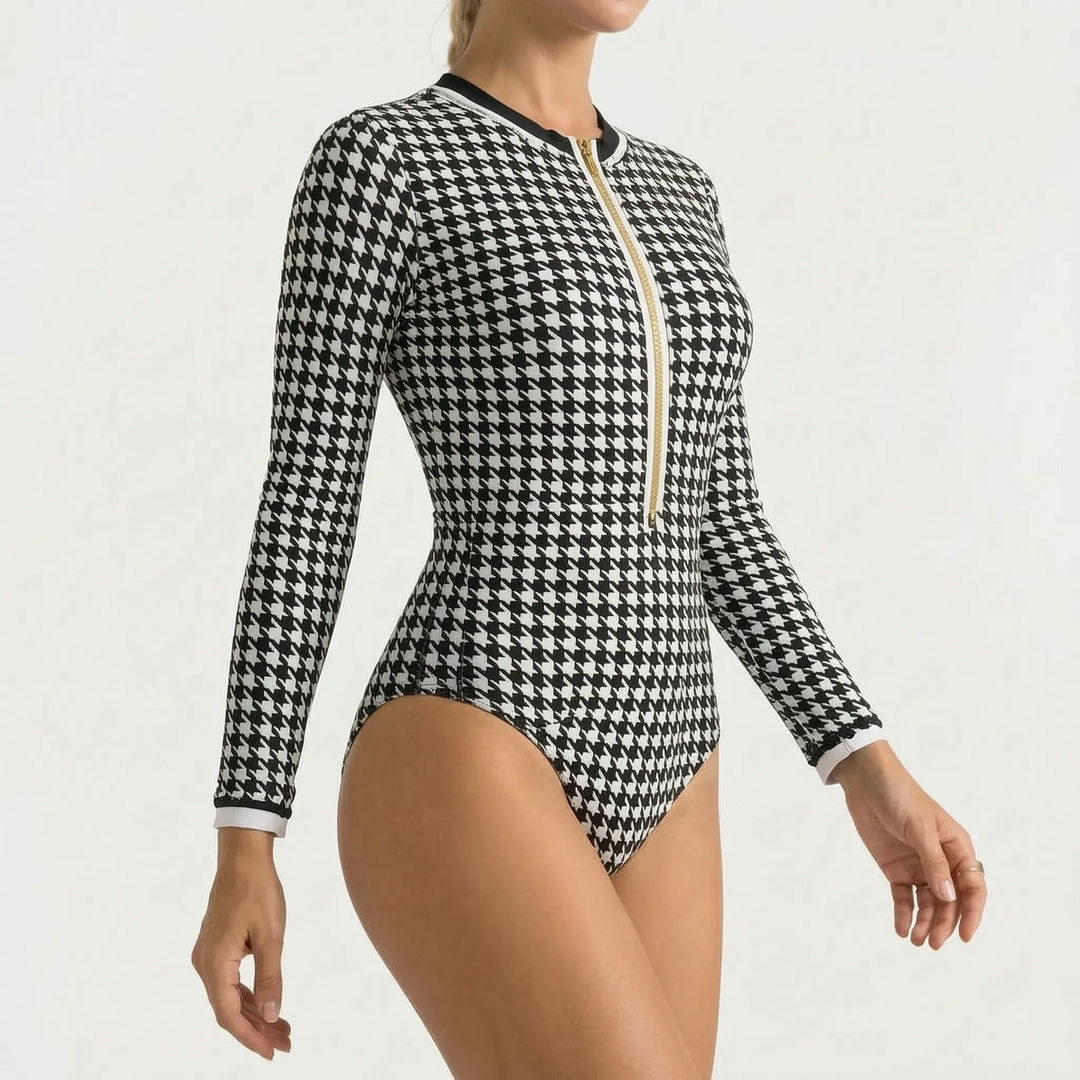 Women's long-sleeve one-piece swimwear, front zipper detail, offering comfort & style for the beach.