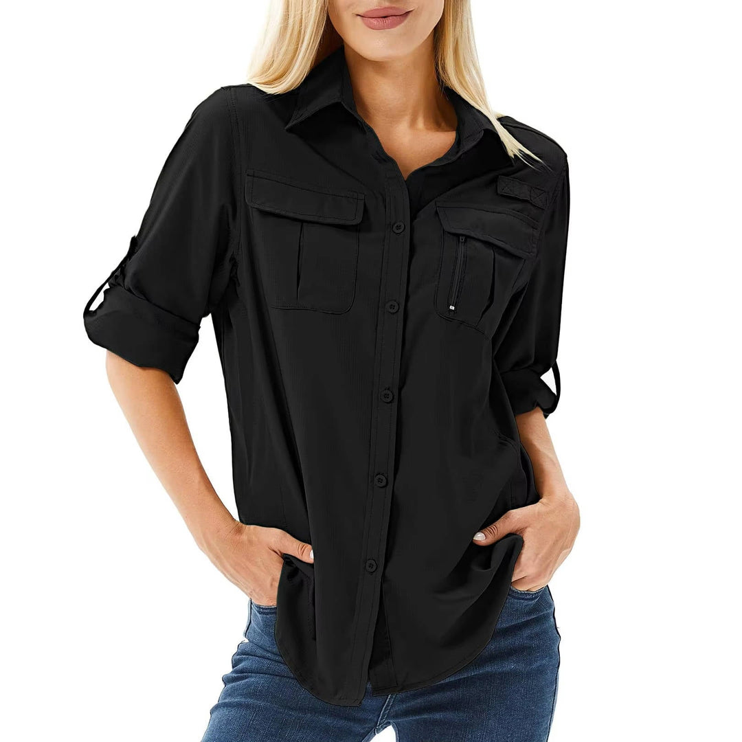 Female angler in a white quick-dry long sleeve fishing shirt, offering sun and UV protection.