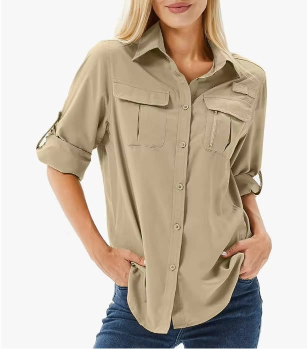 Front view of a green women's UV protection long sleeve safari shirt, with utility pockets.
