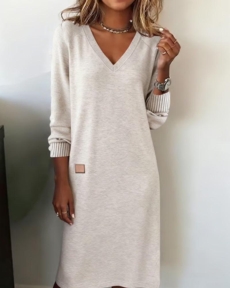 Women's long sleeve V-neck midi dress, perfect for office or casual everyday wear. Versatile and elegant.