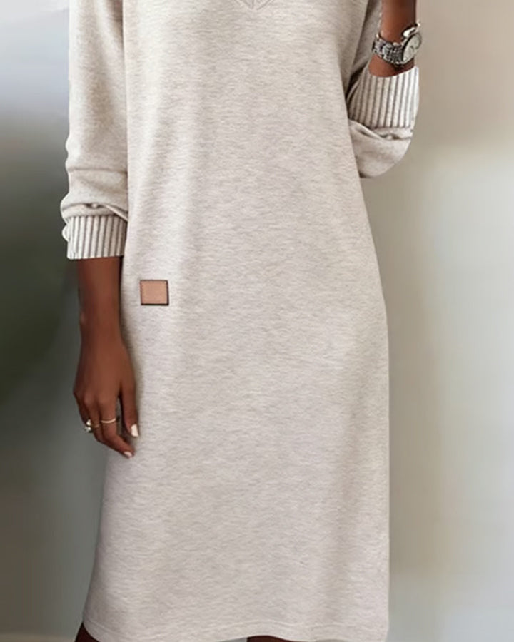 Chic long sleeve V-neck midi dress for women, ideal office wear. Professional and comfortable fall fashion.