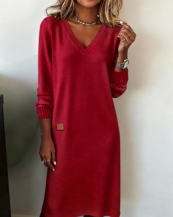 Elegant beige long sleeve V-neck midi dress for women. Perfect fall/winter office wear or casual styling.