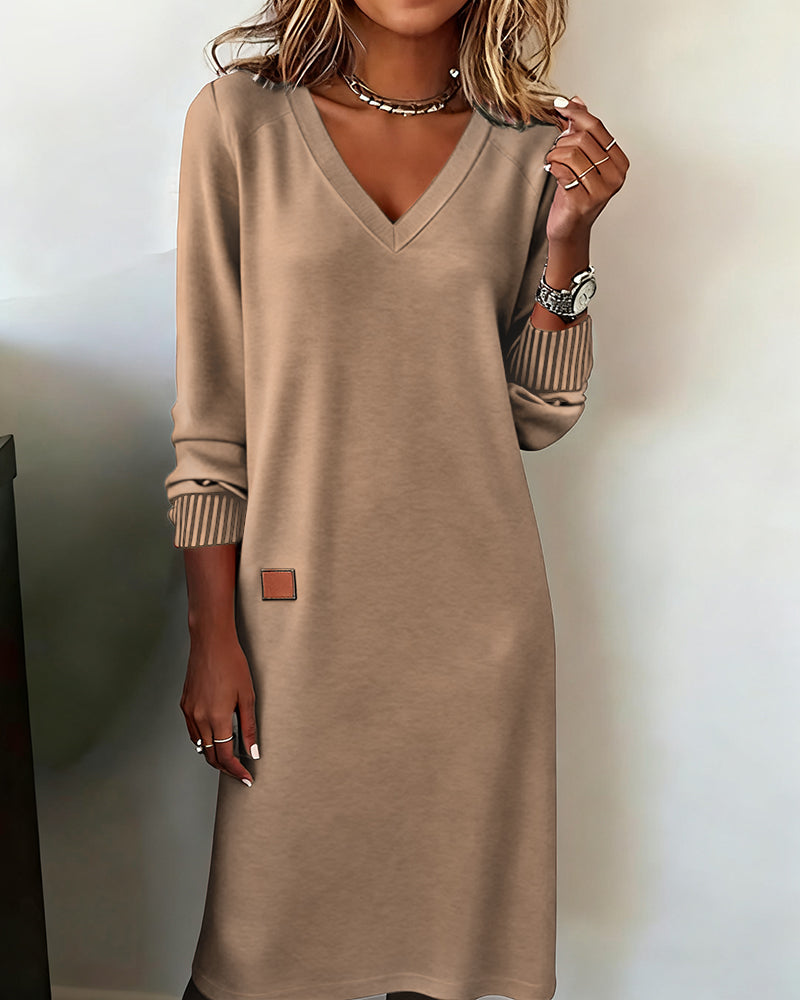 Cozy women's long sleeve V-neck midi dress for fall & winter fashion. Elegant everyday or office attire.