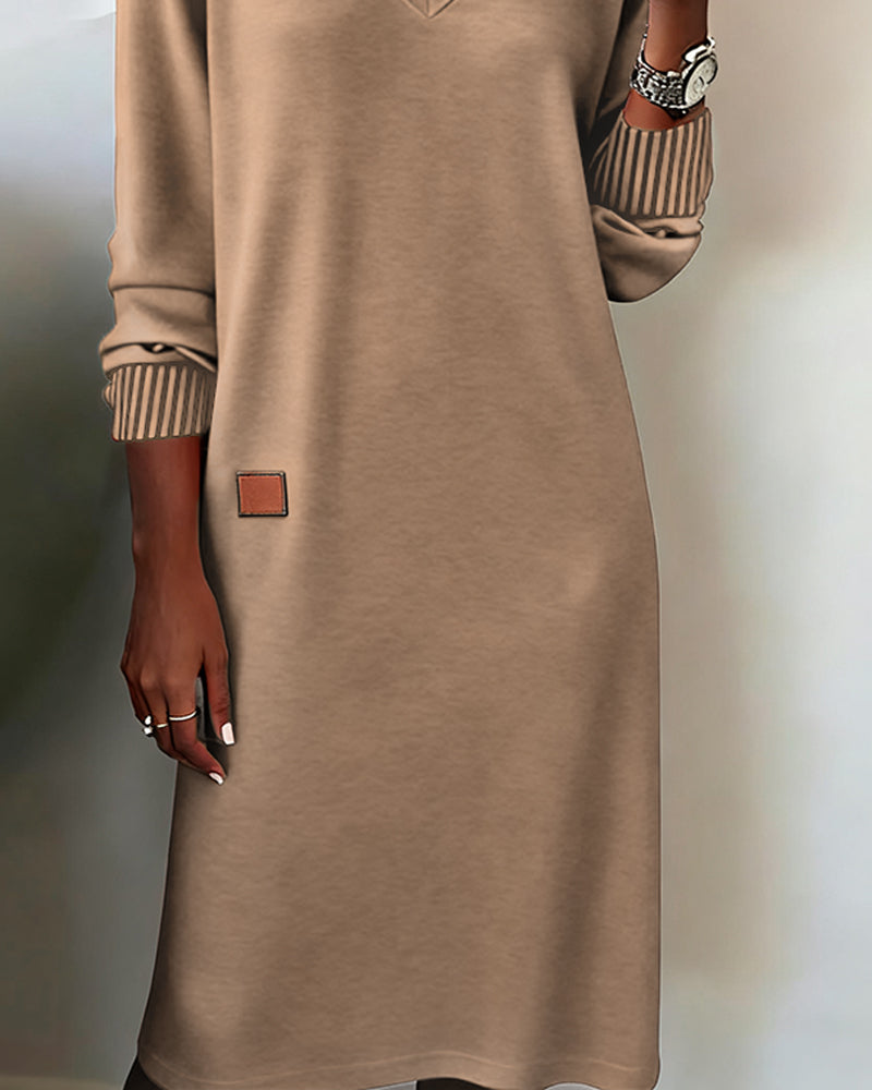 Women's versatile long sleeve V-neck midi dress, great for professional office wear or a stylish casual look.