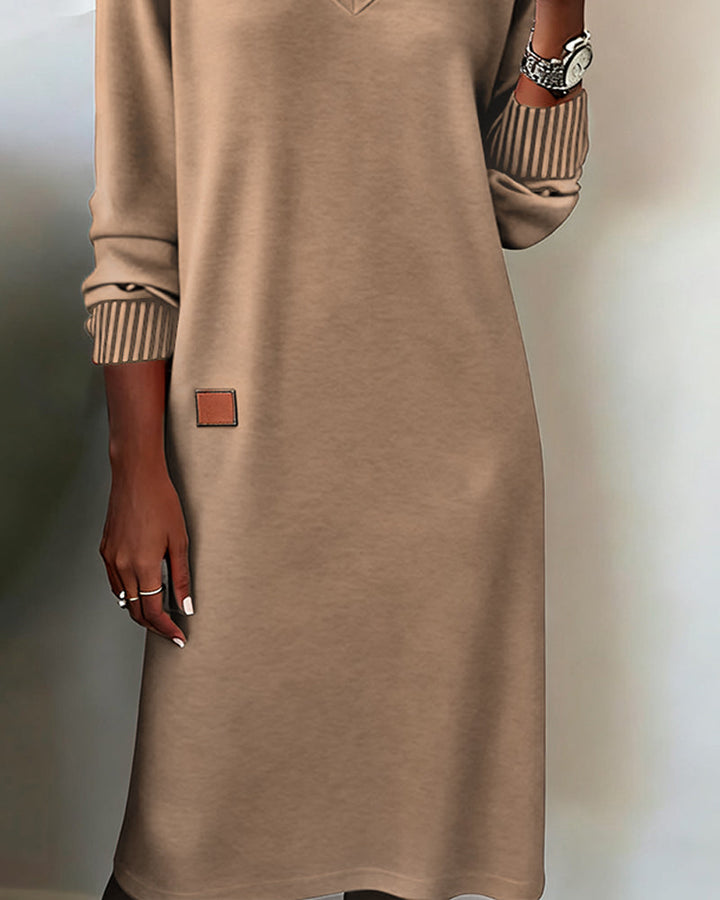 Women's versatile long sleeve V-neck midi dress, great for professional office wear or a stylish casual look.