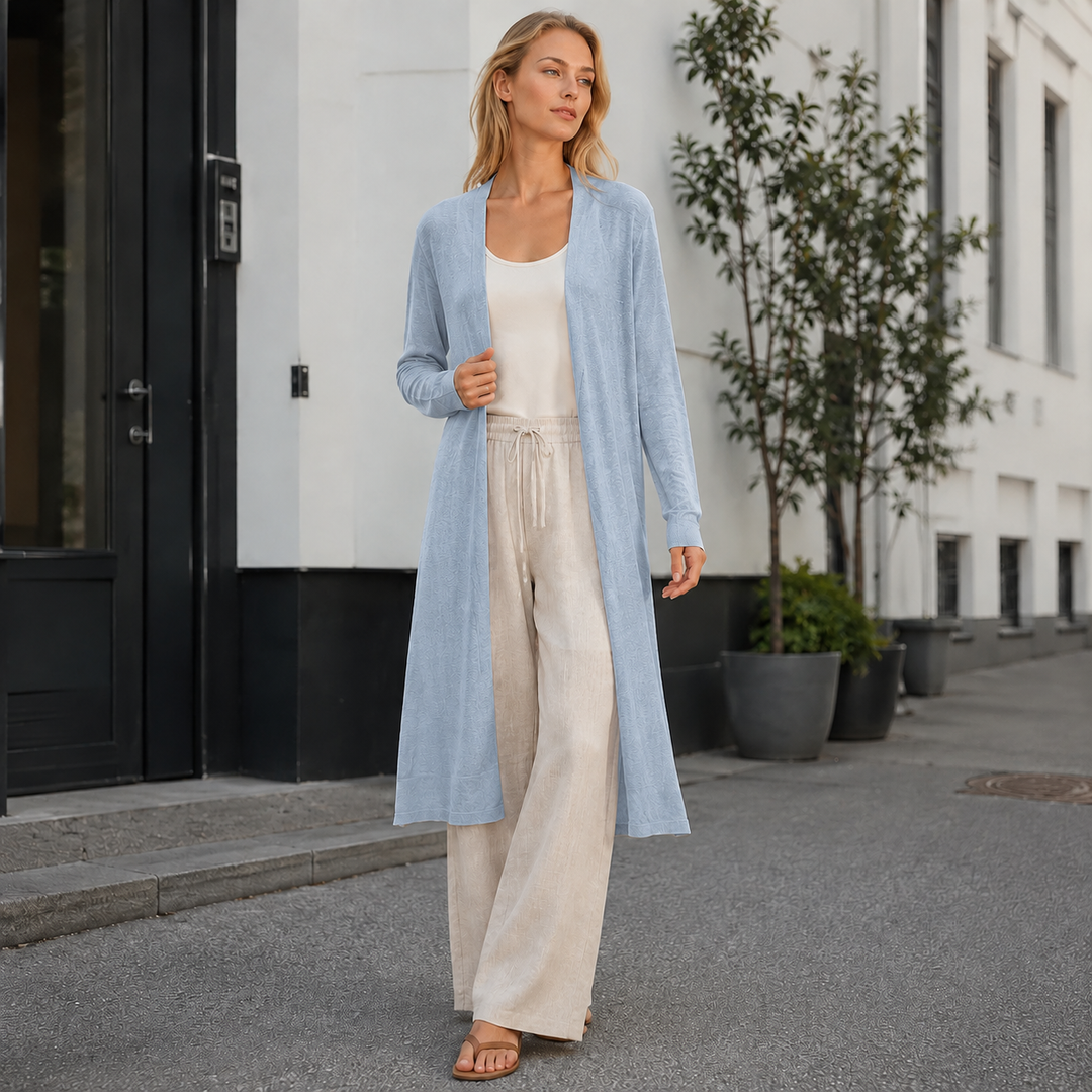 Women's long warm knit cardigan, perfect for layering during fall & winter. Cozy & versatile outerwear.