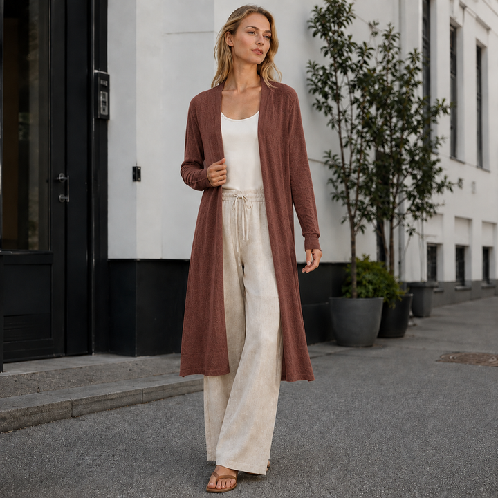 Versatile women's long knit cardigan, great for layering over tops. Adds warmth to any fall or winter outfit.