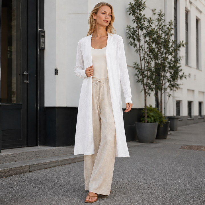 Embrace fall & winter style with this warm long women's knit cardigan. Essential cozy outerwear for layering.