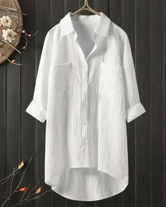 Women's longline casual blouse with collar, double pockets & roll-tab sleeves. Perfect for summer everyday wear.