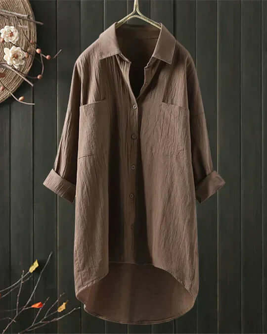 Versatile women's longline blouse with collared neck, button front & functional double pockets. Great for summer.