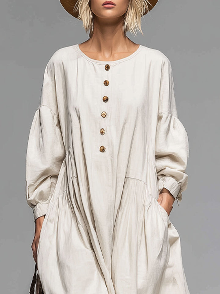 Comfortable women's long sleeve midi dress with stylish button-front design and handy pockets for versatile wear.