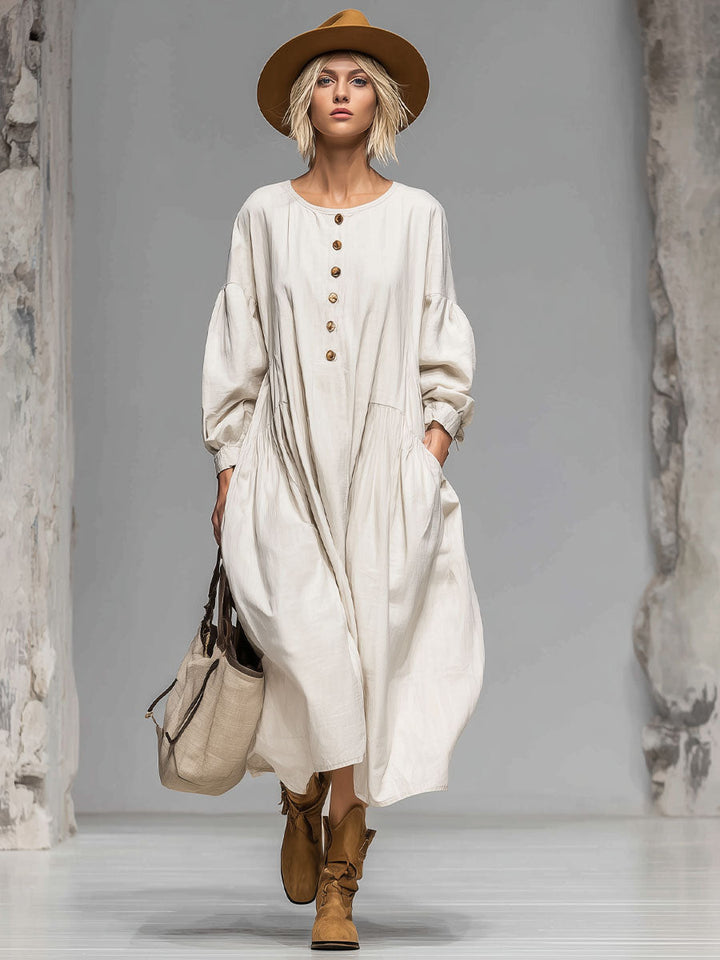 Fashionable women's casual midi dress with a button-front detail, loose silhouette, and essential pockets.