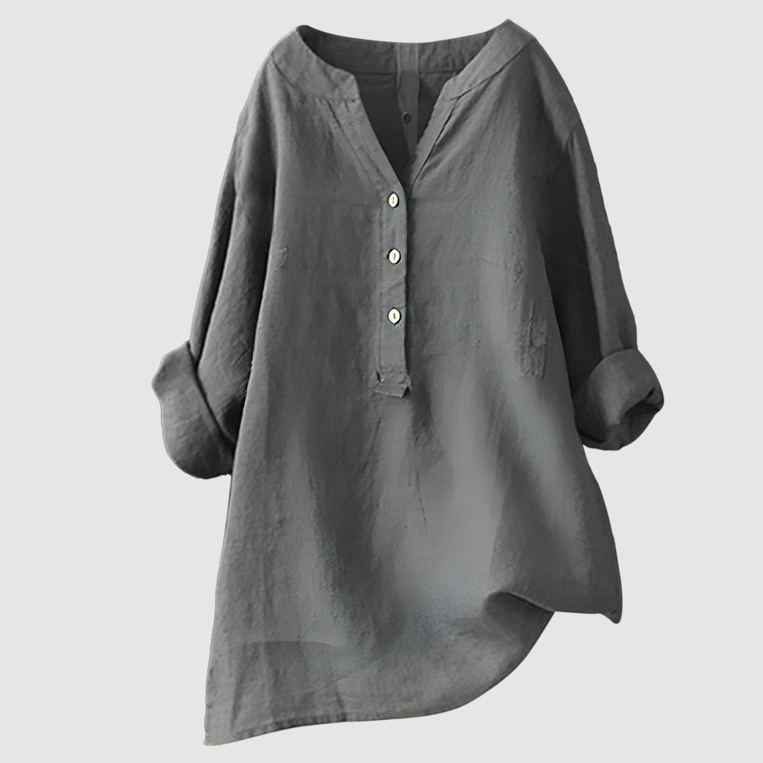 Versatile women's button-up blouse, loose fit v-neck, and rolled sleeves. Great for casual or elegant styles.