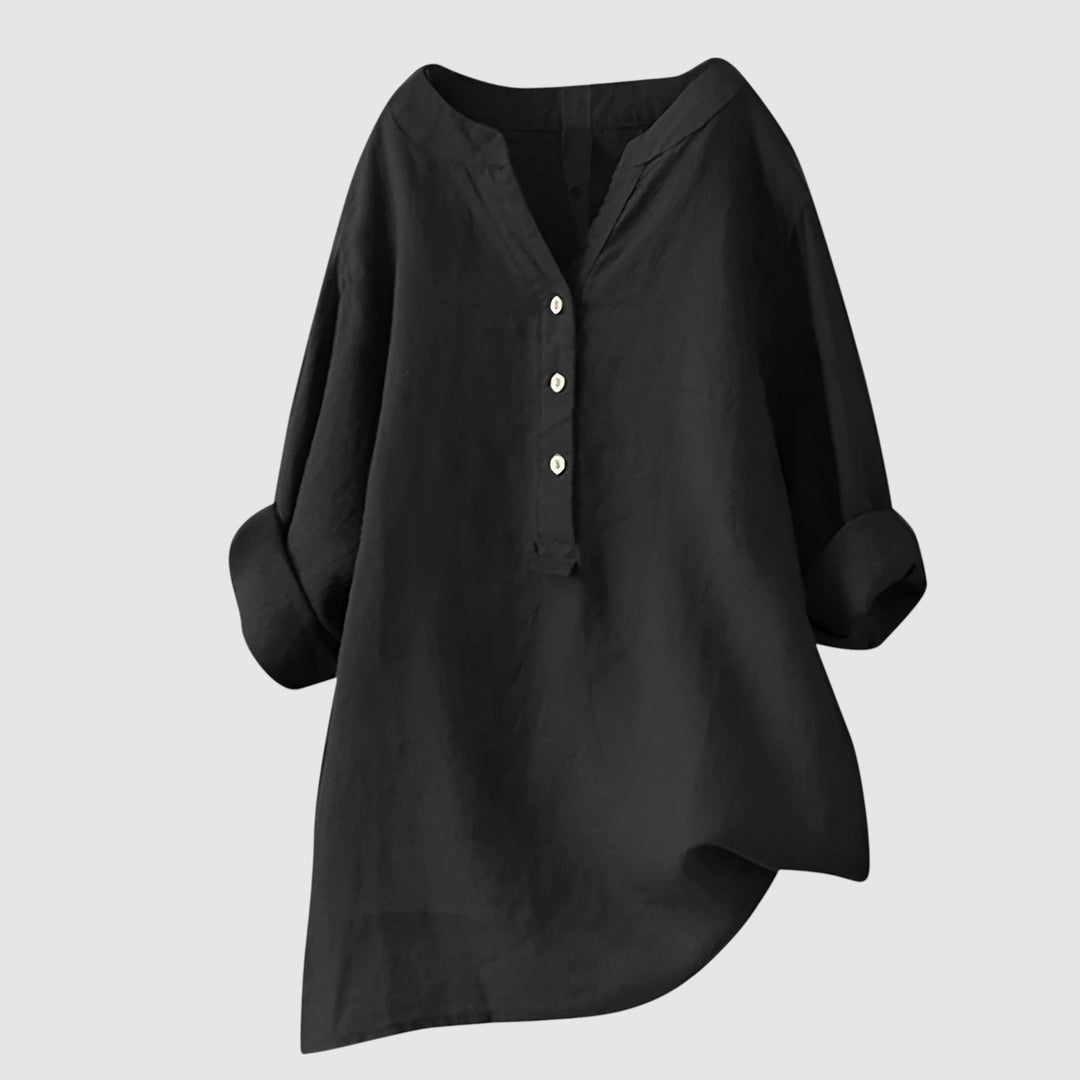 Casual chic women's blouse. Loose fit, v-neck top with rolled sleeves. Ideal for spring/summer fashion.