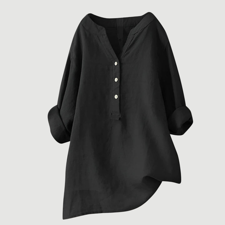 Casual chic women's blouse. Loose fit, v-neck top with rolled sleeves. Ideal for spring/summer fashion.