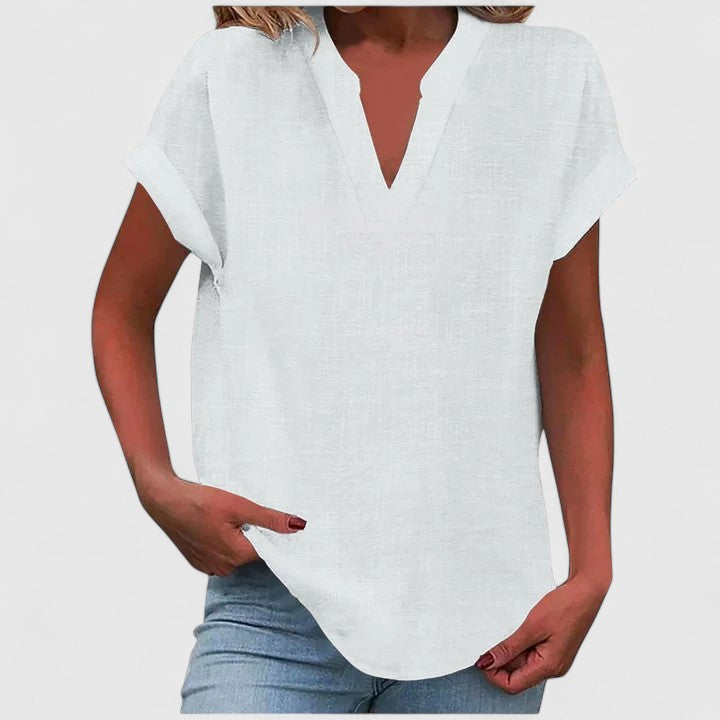 Summer-ready women's V-neck cap sleeve blouse, loose fit & comfortable, paired with shorts.