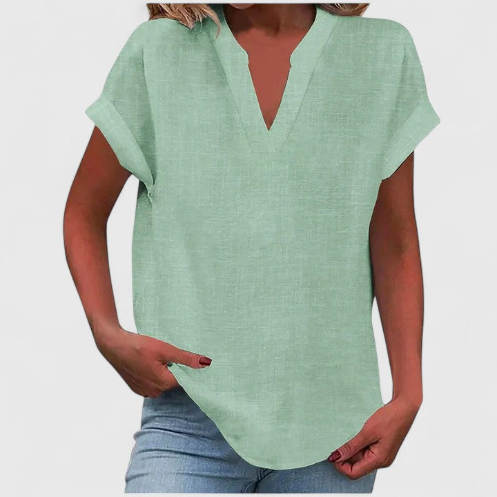 Women's casual V-neck blouse, loose fit design with elegant cap sleeves and curved hem detail.