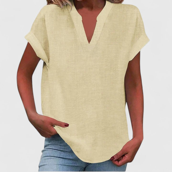 Studio shot of women's loose fit V-neck casual blouse, highlighting quality & design for everyday wear.