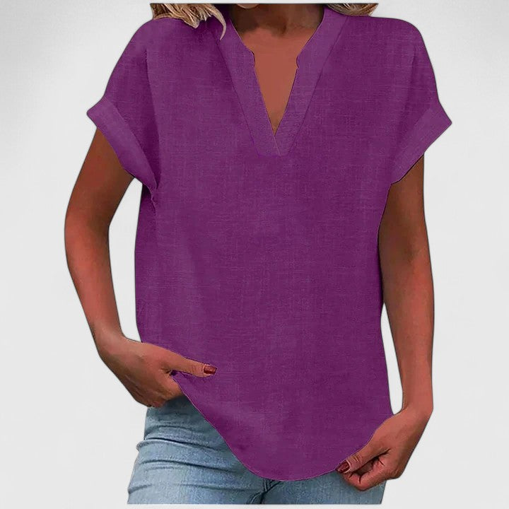 Chic women's V-neck casual blouse, loose fit & cap sleeve, ideal for relaxed spring/summer style.