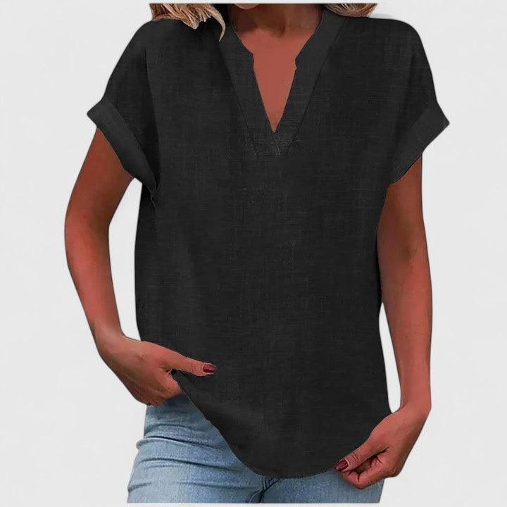 Comfortable loose fit women's V-neck blouse, cap sleeves & curved hem for casual wear.