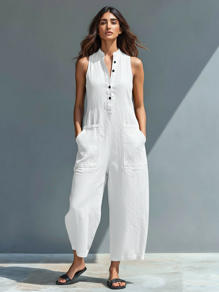 Loose fit sleeveless women's jumpsuit. Button-up front, stand collar for comfy everyday and travel wear.
