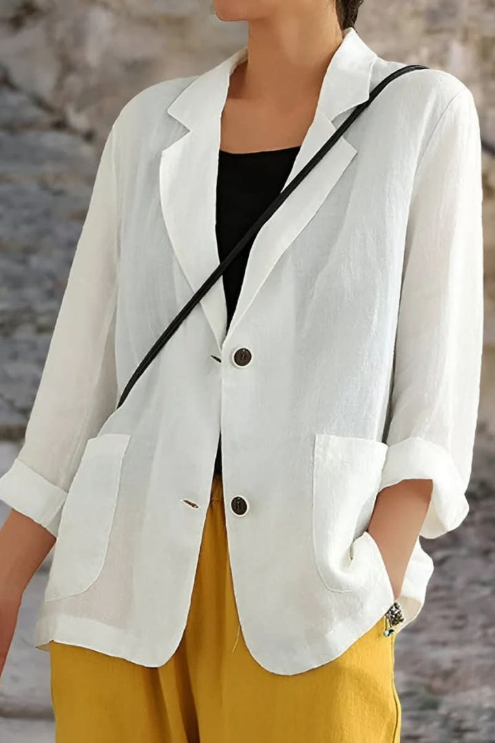 Women's luxe open back blazer. Tailored for modern elegance, perfect for business attire or chic casual occasions.