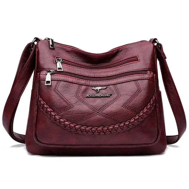 Premium women's soft leather shoulder bag, a versatile luxury handbag with an adjustable strap.